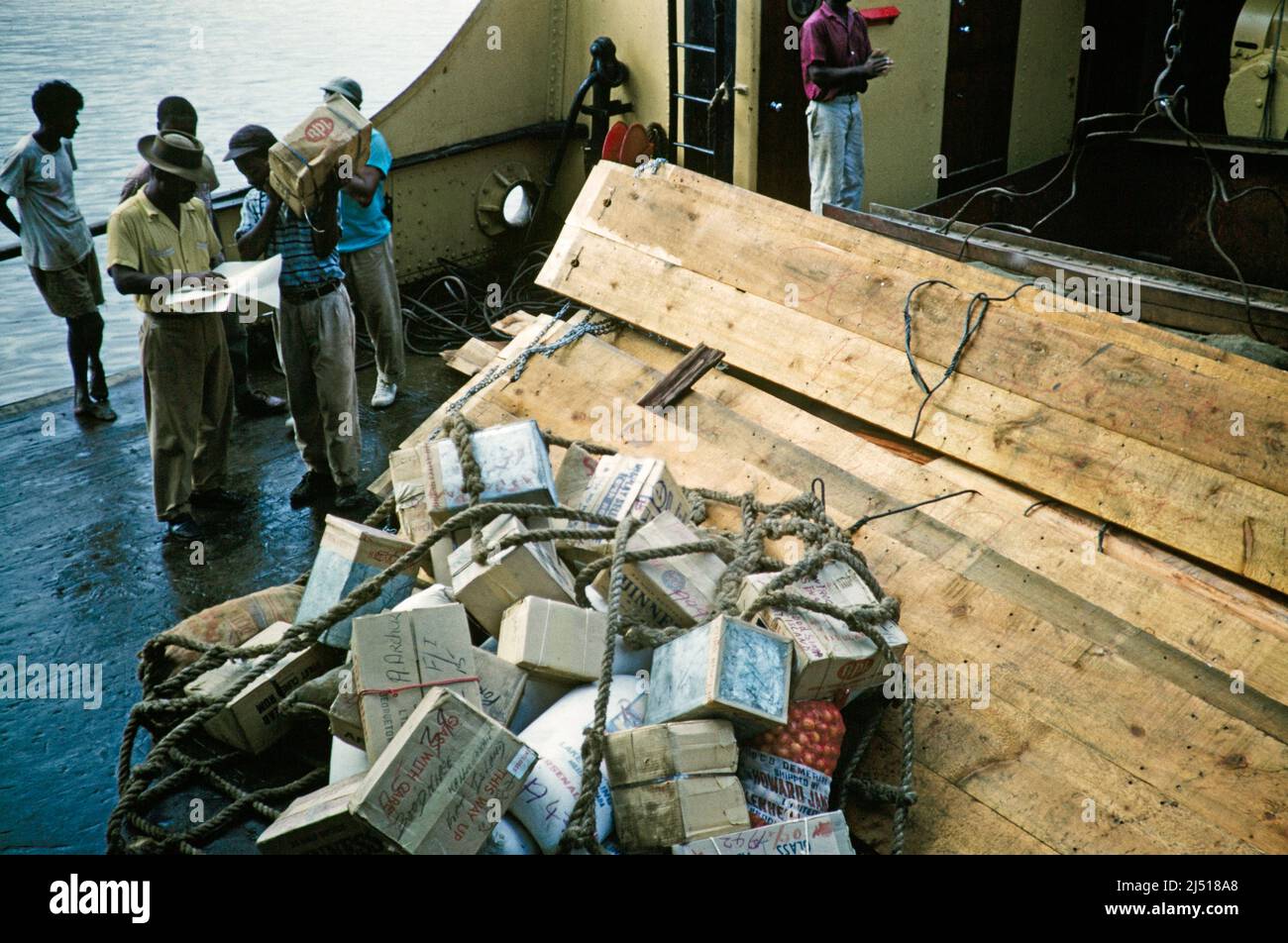 Captioned as 'Goods for Locals' cardboard boxes aboard a ship, Guyana