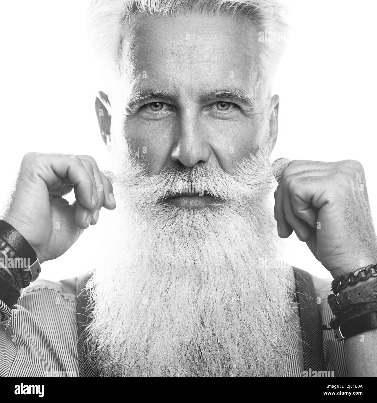 Stylish and handsome bearded senior man on white background Stock Photo