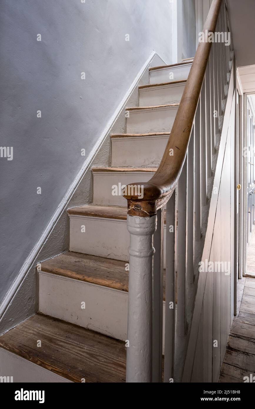 Worn stair treads in Grade II listed 1820s London cottage, UK Stock Photo