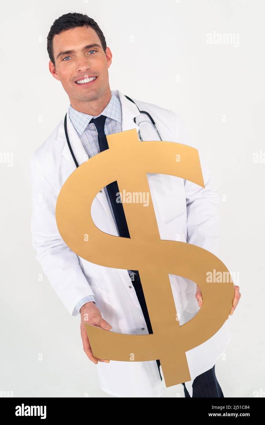 Happy smiling male doctor holding dollar sign. Cost of medical health insurance healthcare concept. Stock Photo