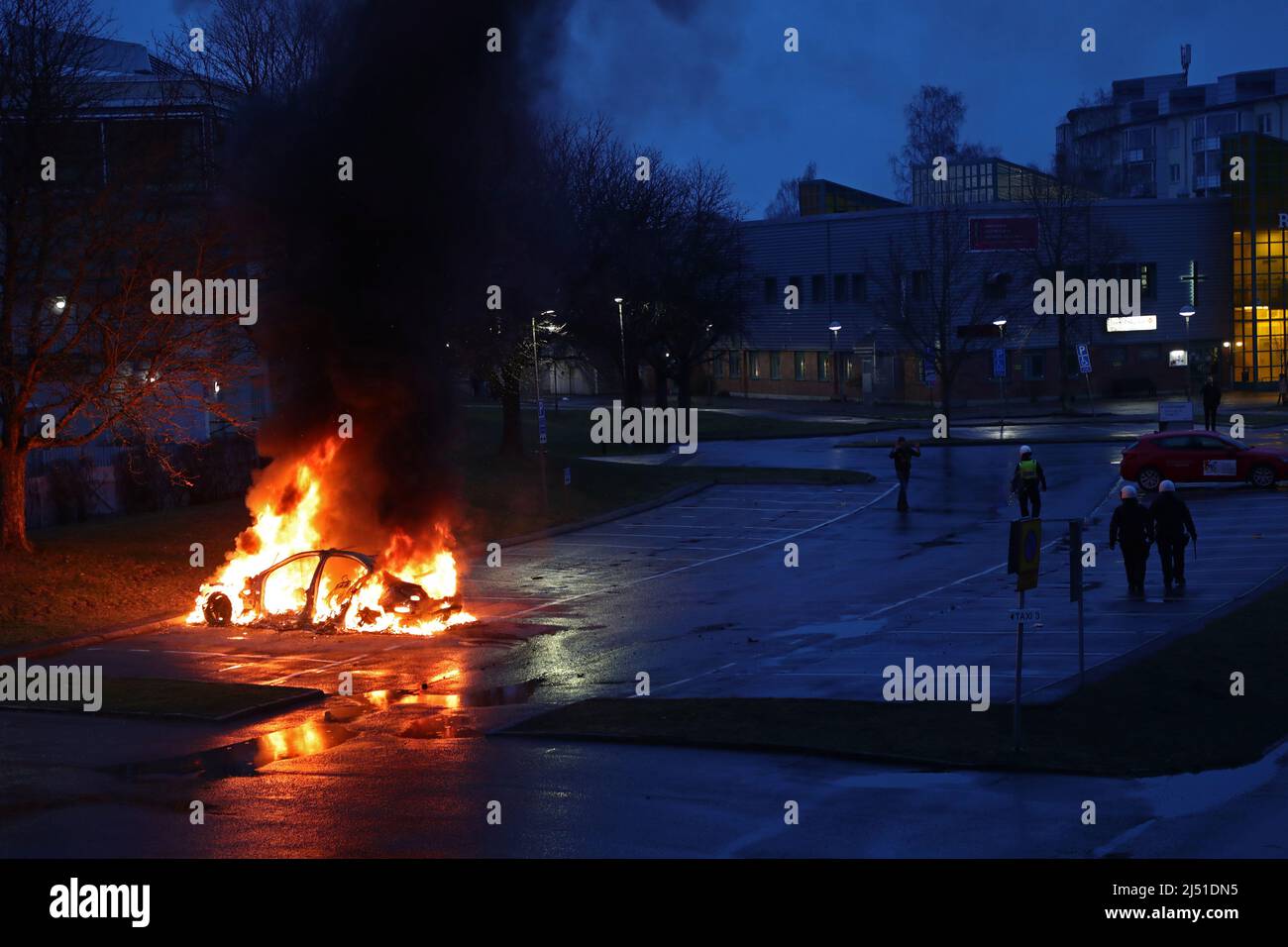 Three policemen were taken to hospital and two people have been arrested in connection with a violent riot in the Linköping district Skäggetorp, where the right-wing extremist Stram kurs (In english: Hard Line) had planned a demonstration. There was also a riot in Norrköping during the There was also a riot in Norrköping during the evening, with several car fires and stone-throwing. In the picture: Ringdansen in Navestad area during Thursday evening. Stock Photo