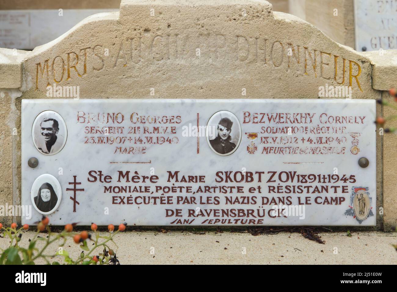 Commemorative plaque devoted to Russian noblewoman Maria Skobtsova (1891-1945) also known as Mother Maria in the Memorial chapel devoted to Russian white emigrants who attended the French Resistance during the Second World War at the Russian Cemetery in Sainte-Geneviève-des-Bois (Cimetière russe de Sainte-Geneviève-des-Bois) near Paris, France. Russian soldiers of the French Army Georges Bruno (1907-1940) and Cornely Bezwerkhy (1912-1940) who died during the Battle of France during World War II are also listed on the plaque. Stock Photo