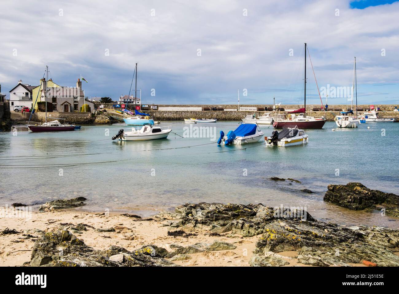 Boats moored in Cemaes harbour at high tide on the north coast. Cemaes Bay, Cemaes, Isle of Anglesey, north Wales, UK, Britain Stock Photo