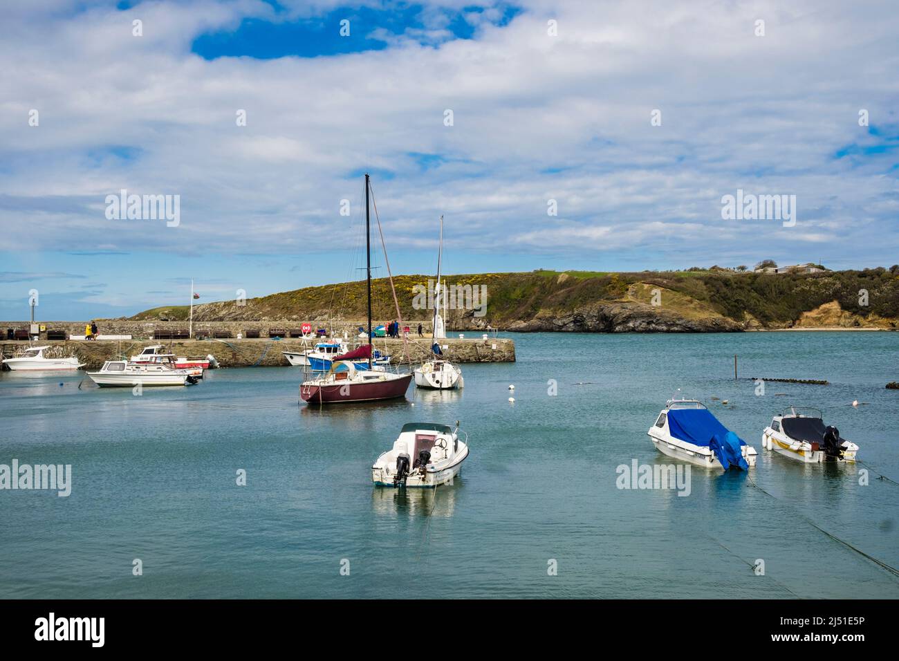 Boats moored in Cemaes harbour at high tide on the north coast. Cemaes Bay, Cemaes, Isle of Anglesey, north Wales, UK, Britain Stock Photo