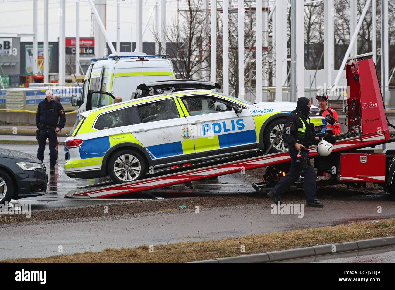 Three policemen were taken to hospital and two people have been arrested in connection with a violent riot in the Linköping district Skäggetorp, where the right-wing extremist Stram kurs (In english: Stram course) had planned a demonstration. The picture shows police cars that were destroyed during the incident. Stock Photo