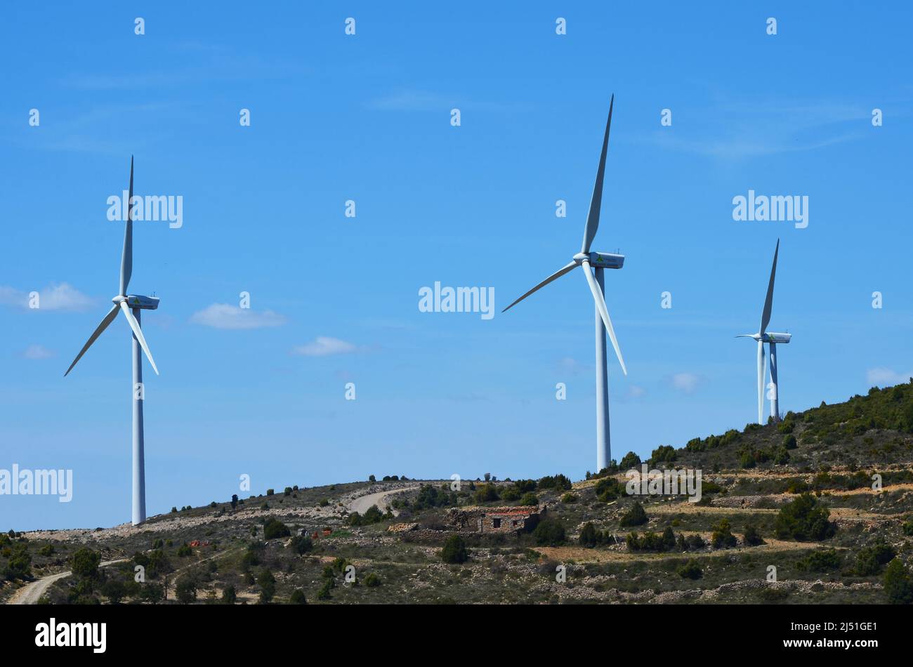 Massive wind turbine towers in a mountainous area of Valencia region, eastern Spain Stock Photo