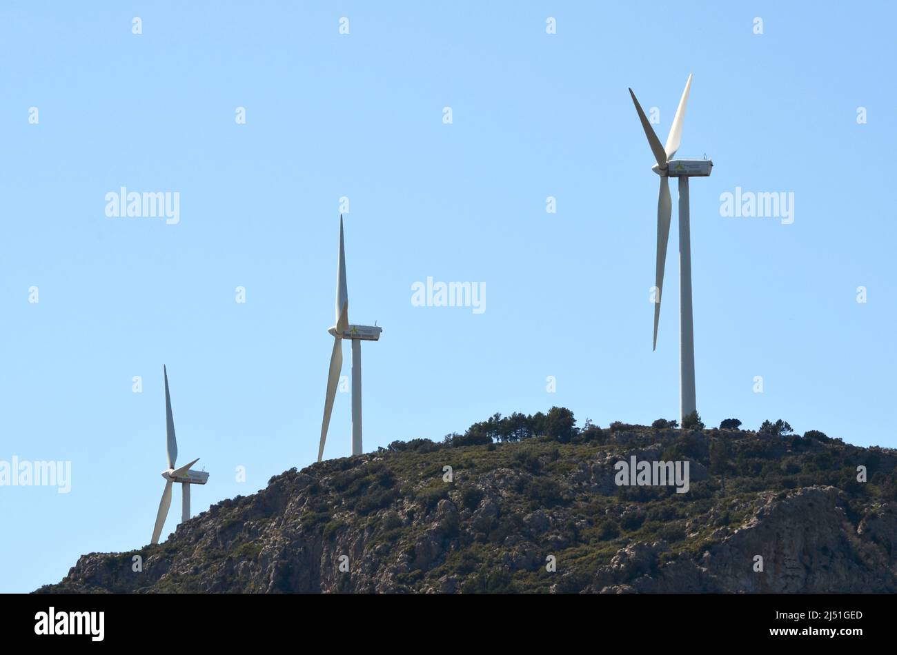 Massive wind turbine towers in a mountainous area of Valencia region, eastern Spain Stock Photo