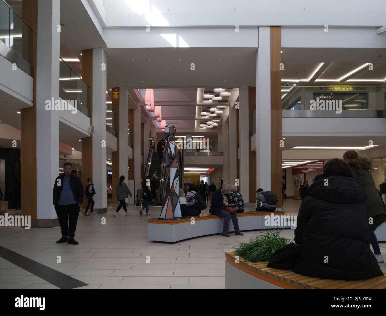Inside the busy  iconic Victoria Shopping Centre Nottingham England UK light and airy shopping experience Stock Photo