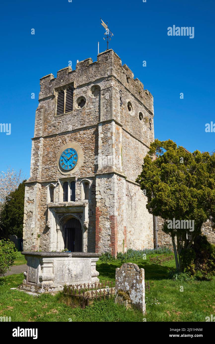 The tower of the ancient church of St Peter and St Paul, in the Kentish village of Appledore, South East England Stock Photo