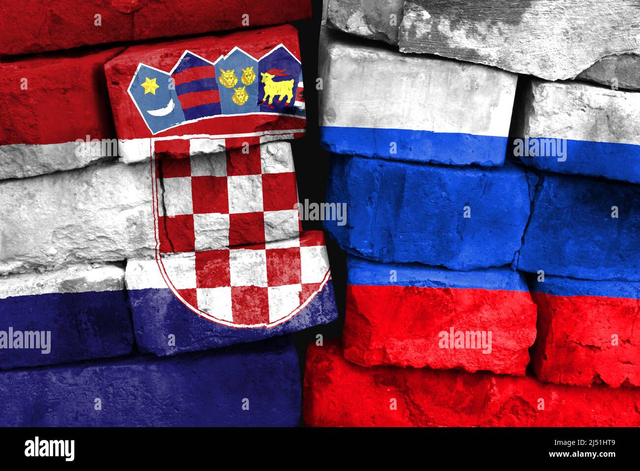 Concept of the relationship between Croatia and Russia with two painted flags on a damaged brick wall Stock Photo