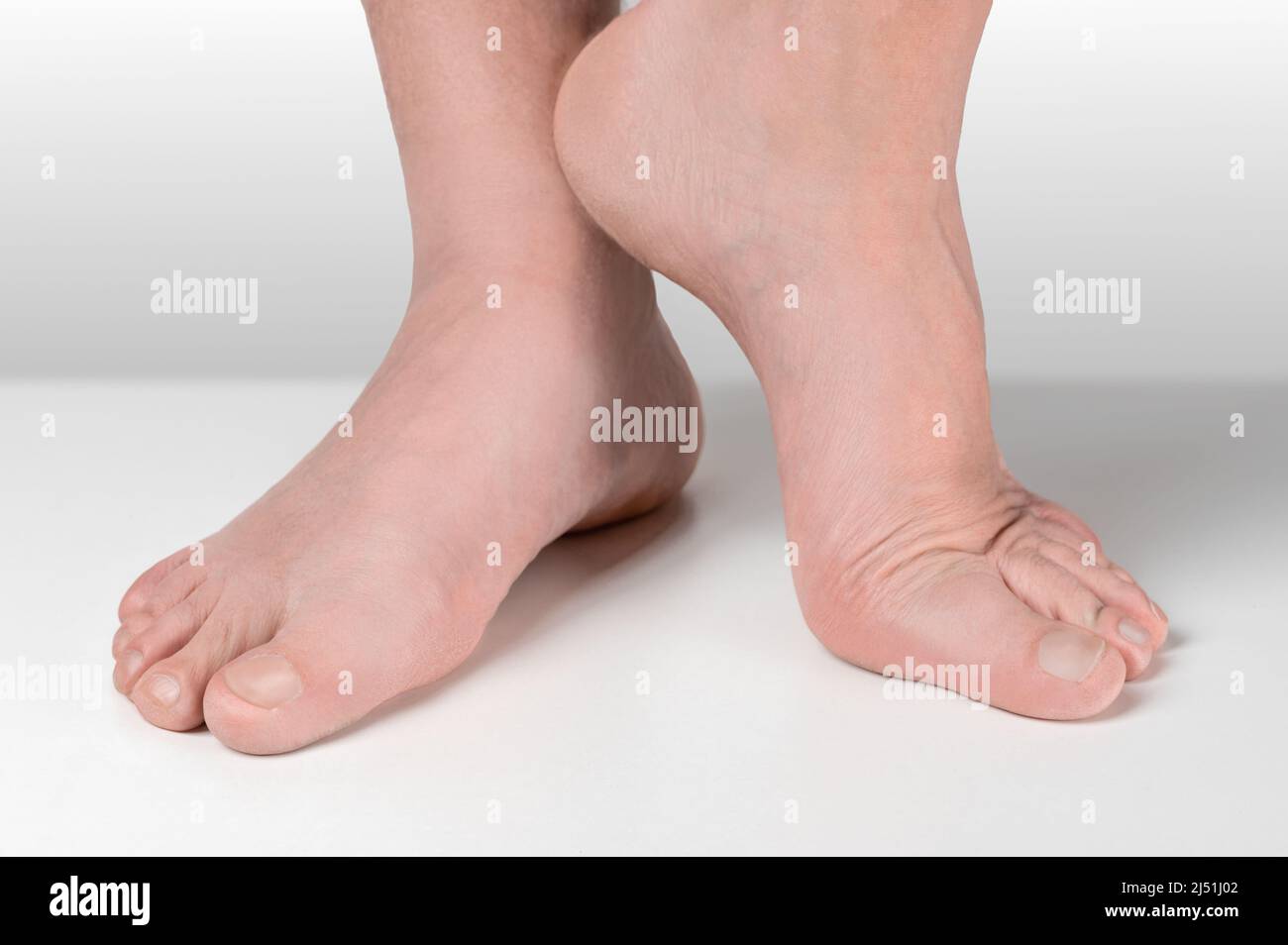 men feet after pedicure on white background. Close up well-groomed feet of an adult man. pedicure and foot care cosmetics Stock Photo