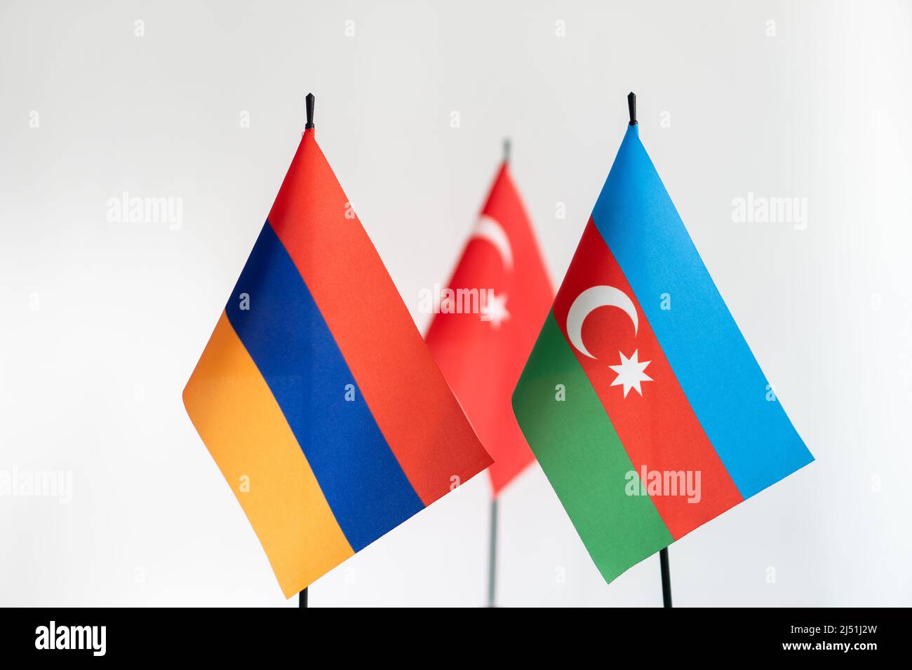 State flags of Azerbaijan Armenia and Turkey on light background. Karabakh conflict concept Stock Photo