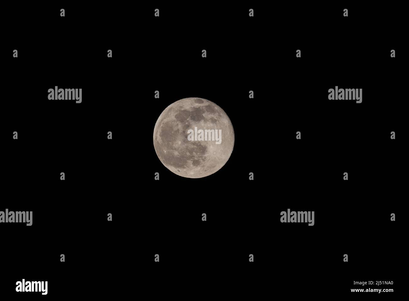 Super full moon with dark black background for placement in video, banner, shot in march 2022, Antwerp, Belgium. High quality photo Stock Photo