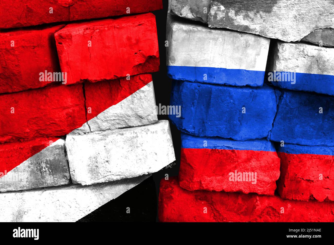 Concept of the relationship between Sealand,Principality of and Russia with two painted flags on a damaged brick wall Stock Photo
