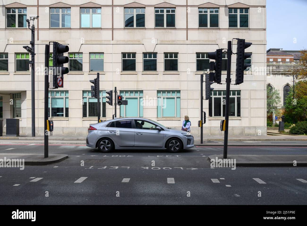 Waiting to cross a road at a pelican crossing hi-res stock photography ...