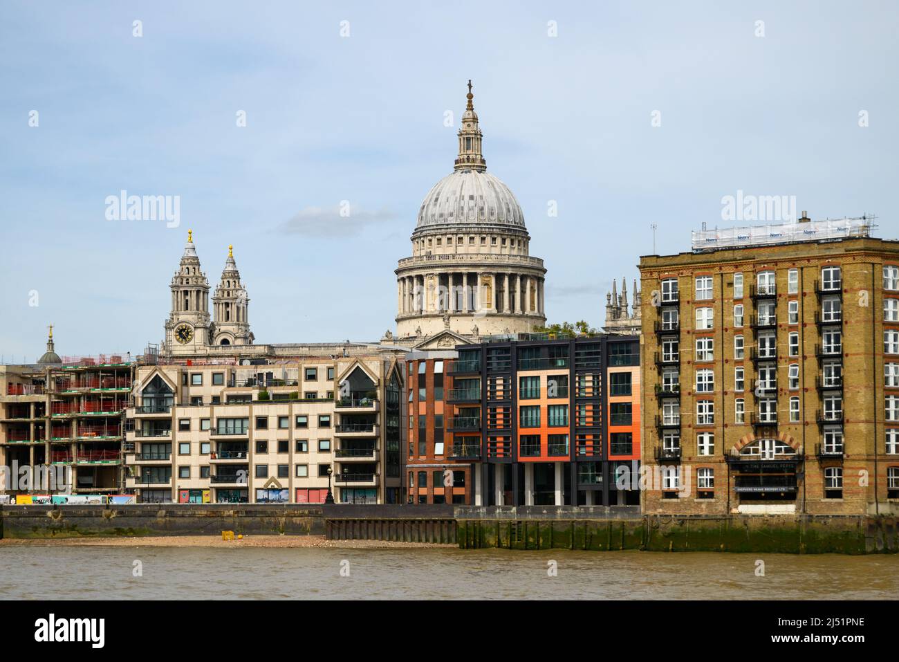 St Pauls Cathedral dome above offices and apartment buildings, view from South Bank, London, UK, April Stock Photo