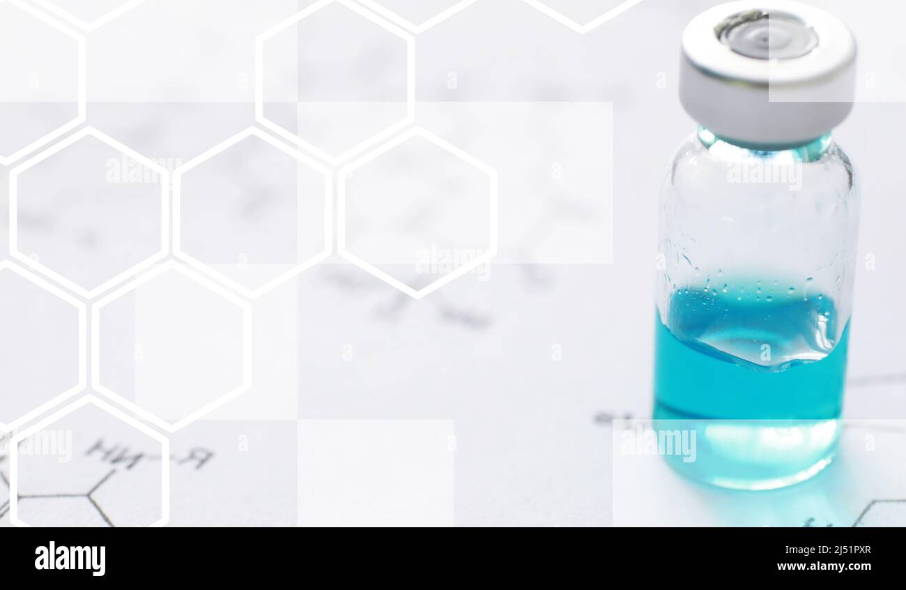 small jars with injection and syringe for injection on blue background ...
