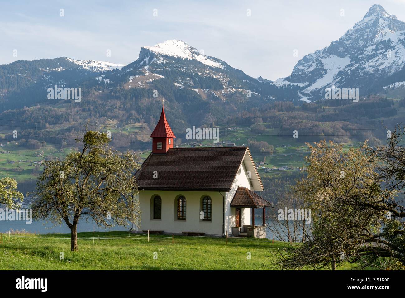 Walensee Spring Weesen, Switzerland, April 13, 2022 Tiny catholic chapel on a hill at ...
