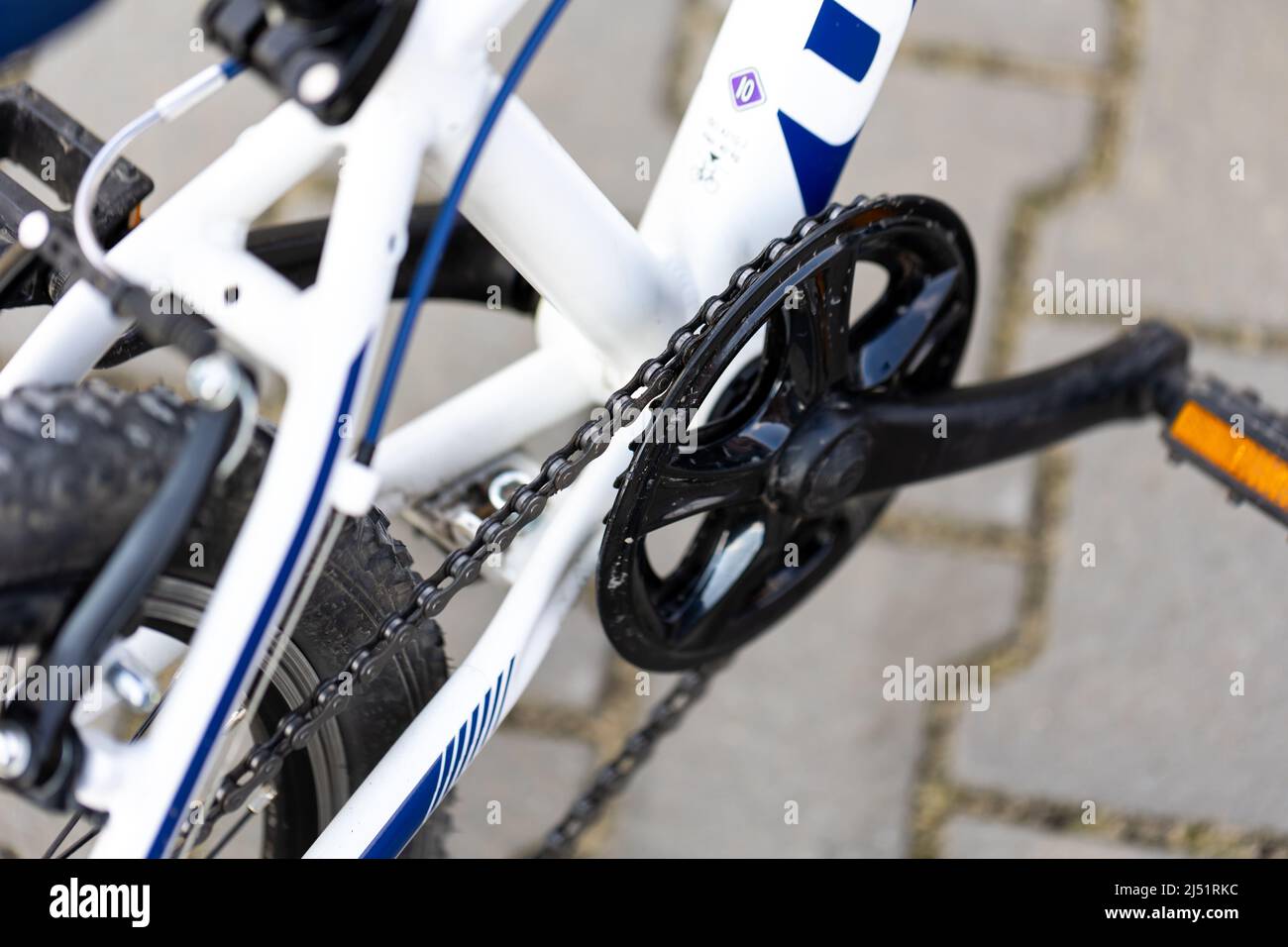 White children's bike, close-up on the crank and bottom bracket. Blurred background, photo taken in natural, soft light Stock Photo