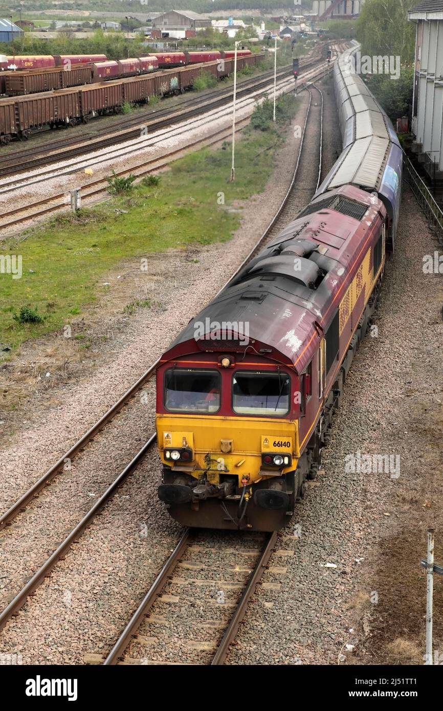 DBS Class 66 loco 66140 hauls the 1215 Immingham to Drax Power Station biomass service through Scunthorpe on 19/4/22. Stock Photo
