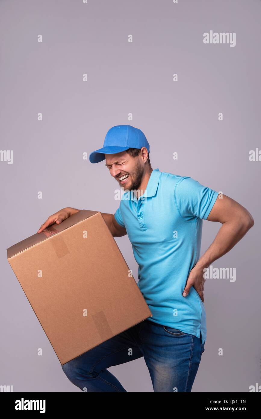 Man lifting heavy box hi-res stock photography and images - Alamy