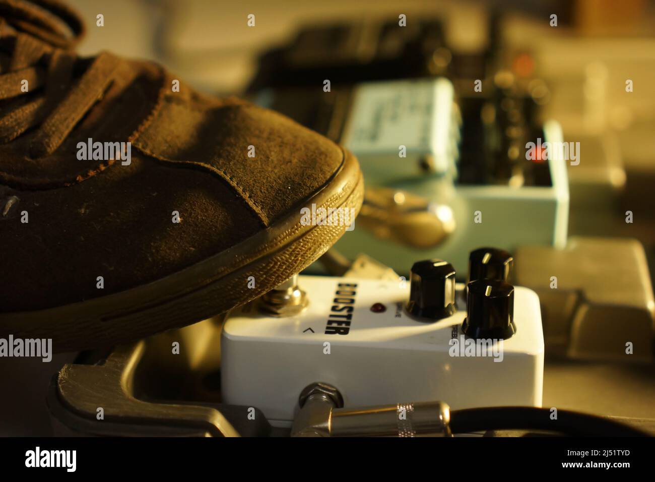 set of pedal effect guitar in carrying box with feet step on it to turn