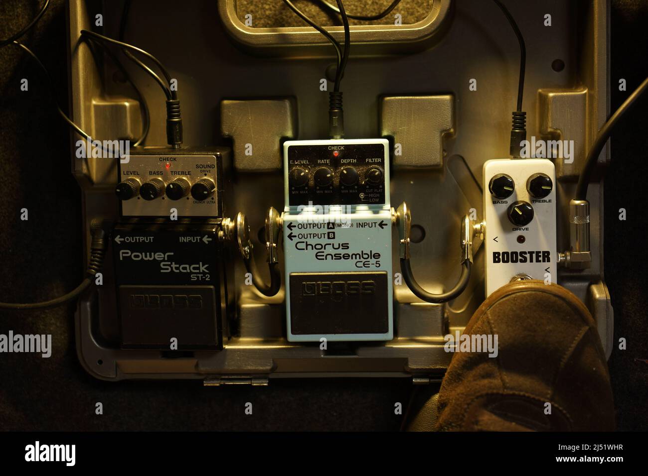 set of pedal effect guitar in carrying box with feet step on it to turn