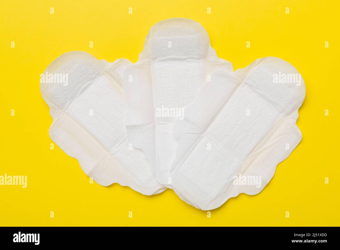 Women hygiene products or sanitary pad on colored background. Pastel ...