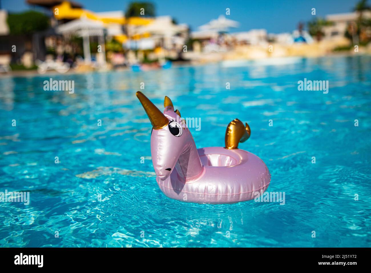 Unicorn inflatable drink holder with cocktail for design purpose Stock Photo