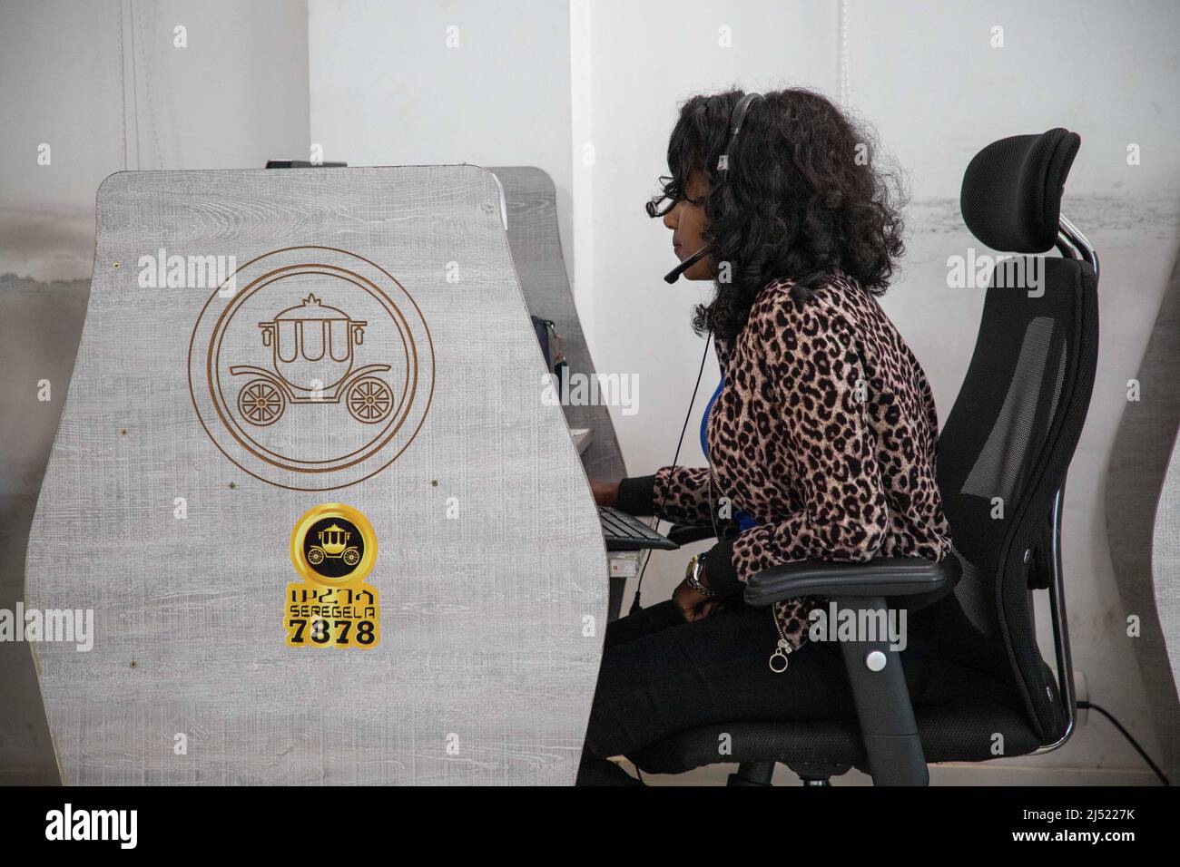 Addis Ababa, Ethiopia. 29th Mar, 2022. A female phone operator works at
