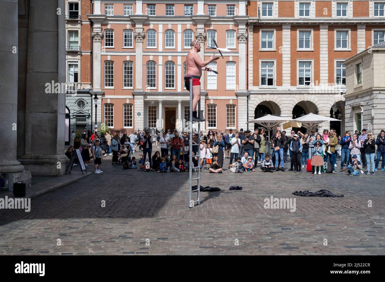 Street performers in Covent Garden, London. Stock Photo