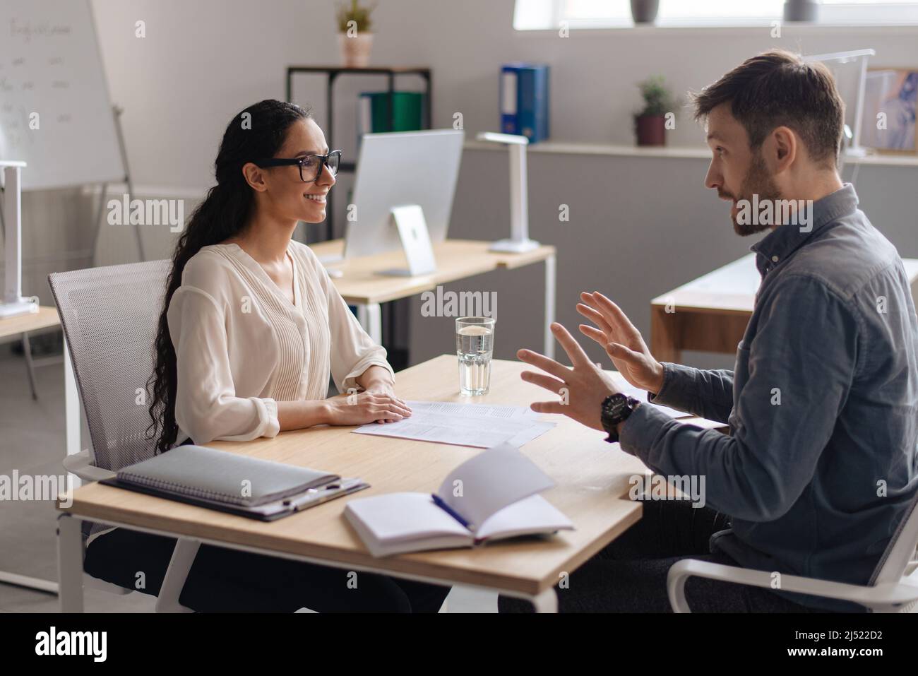 HR manager interviewing potential employee at modern company office. Personnel recruitment