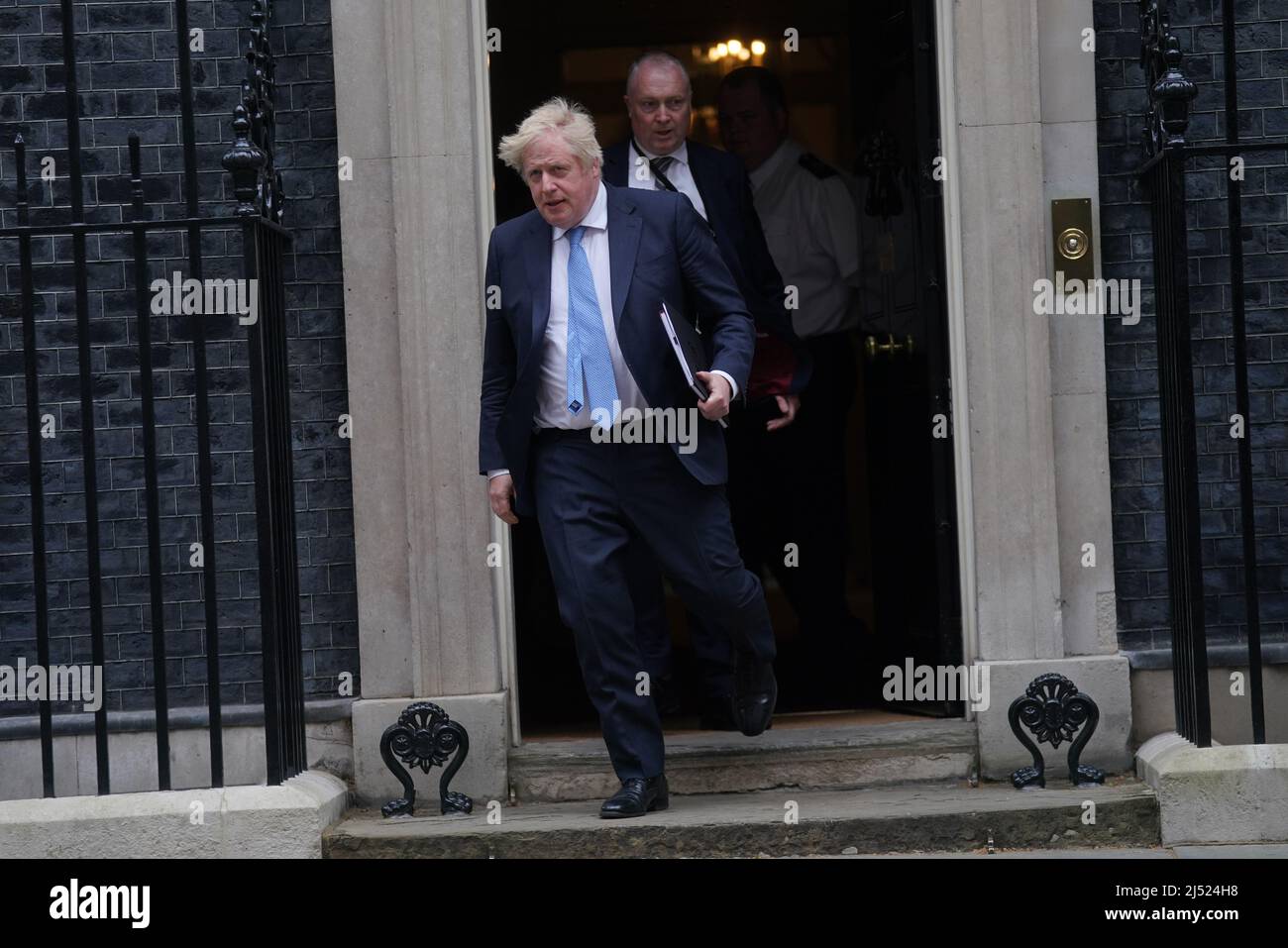 Prime Minister Boris Johnson leaves 10 Downing Street, London, to head to the House of Commons where he is due to make a statement to MPs following the announcement that he is among the 50-plus people fined so far as part of the Metropolitan Police probe into Covid breaches in Government. Picture date: Tuesday April 19, 2022. Stock Photo