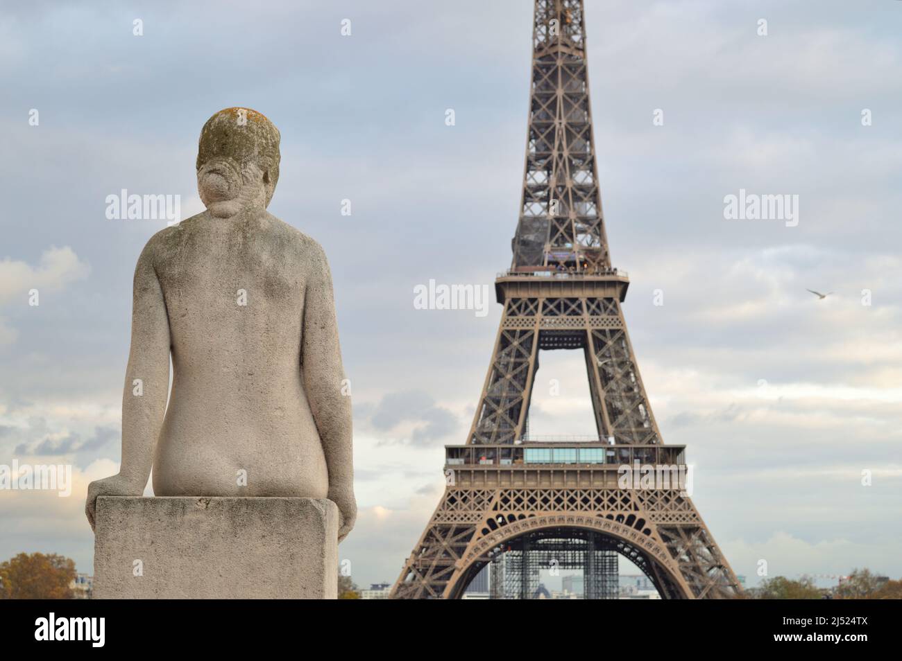 Woman sculpture watching the Eiffel Tower. Paris, France. Stock Photo