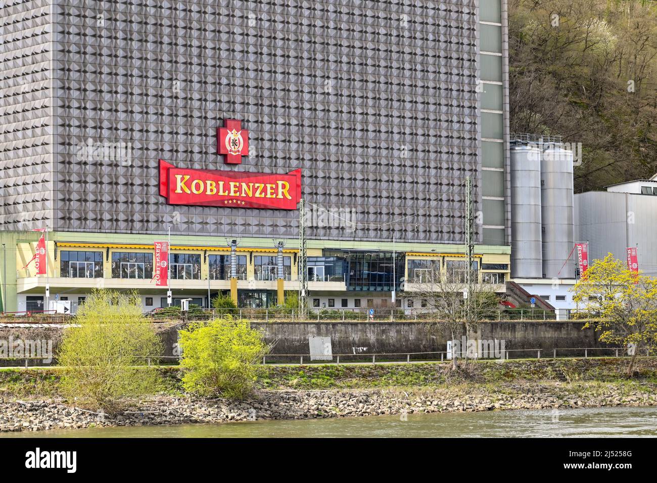 Koblenz, Germany - April 2020: Exterior of the Koblenzer Brauerei brewery on the banks of the River Rhine on the outskirts of the city. Stock Photo