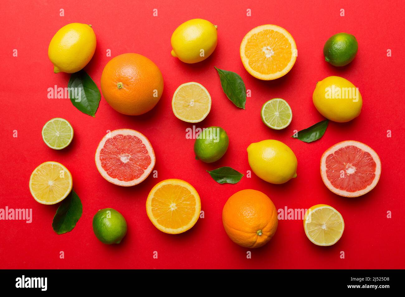 Flat lay of citrus fruits like lime, orange and lemon with lemon tree ...