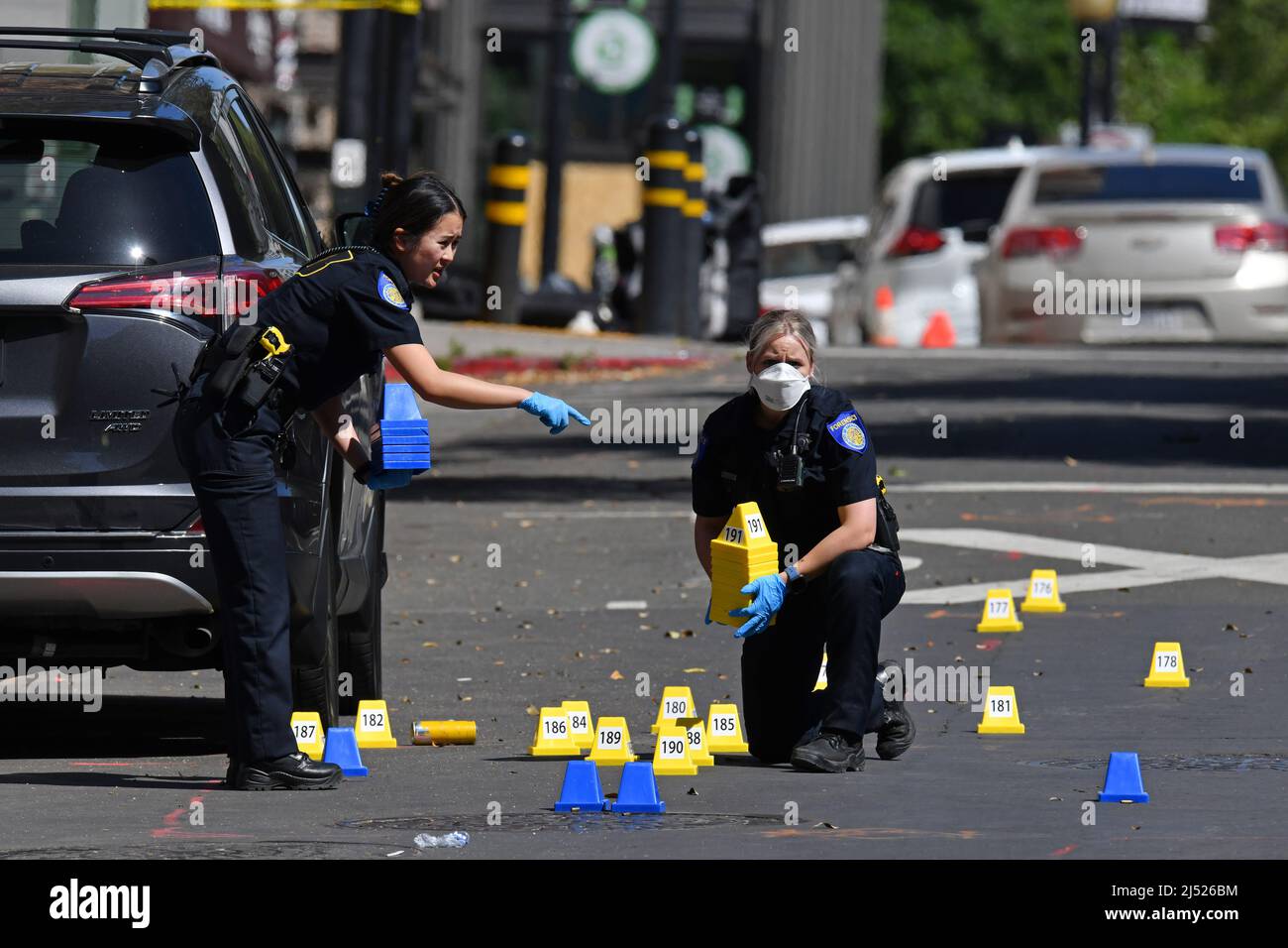 Sacramento Police crime scene investigators place evidence markers on