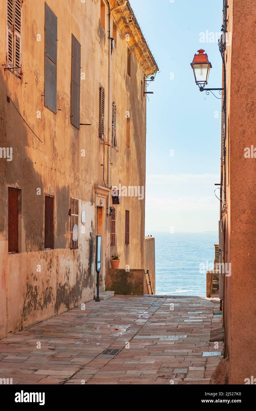 A lane in the old citadel of Bastia with view of the Mediterranean Sea, Corsica Stock Photo