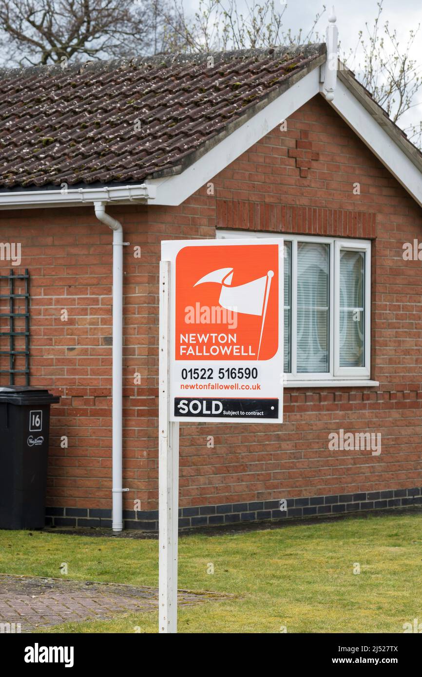 Estate agents SOLD sign Stock Photo