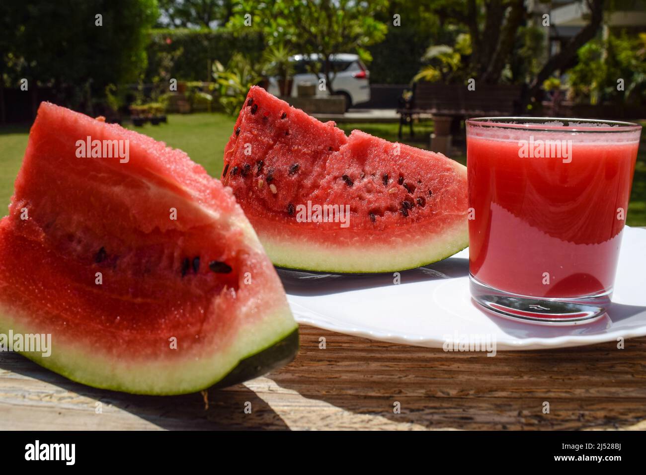 Watermelon juice drink with freshly cut water melon fruit served