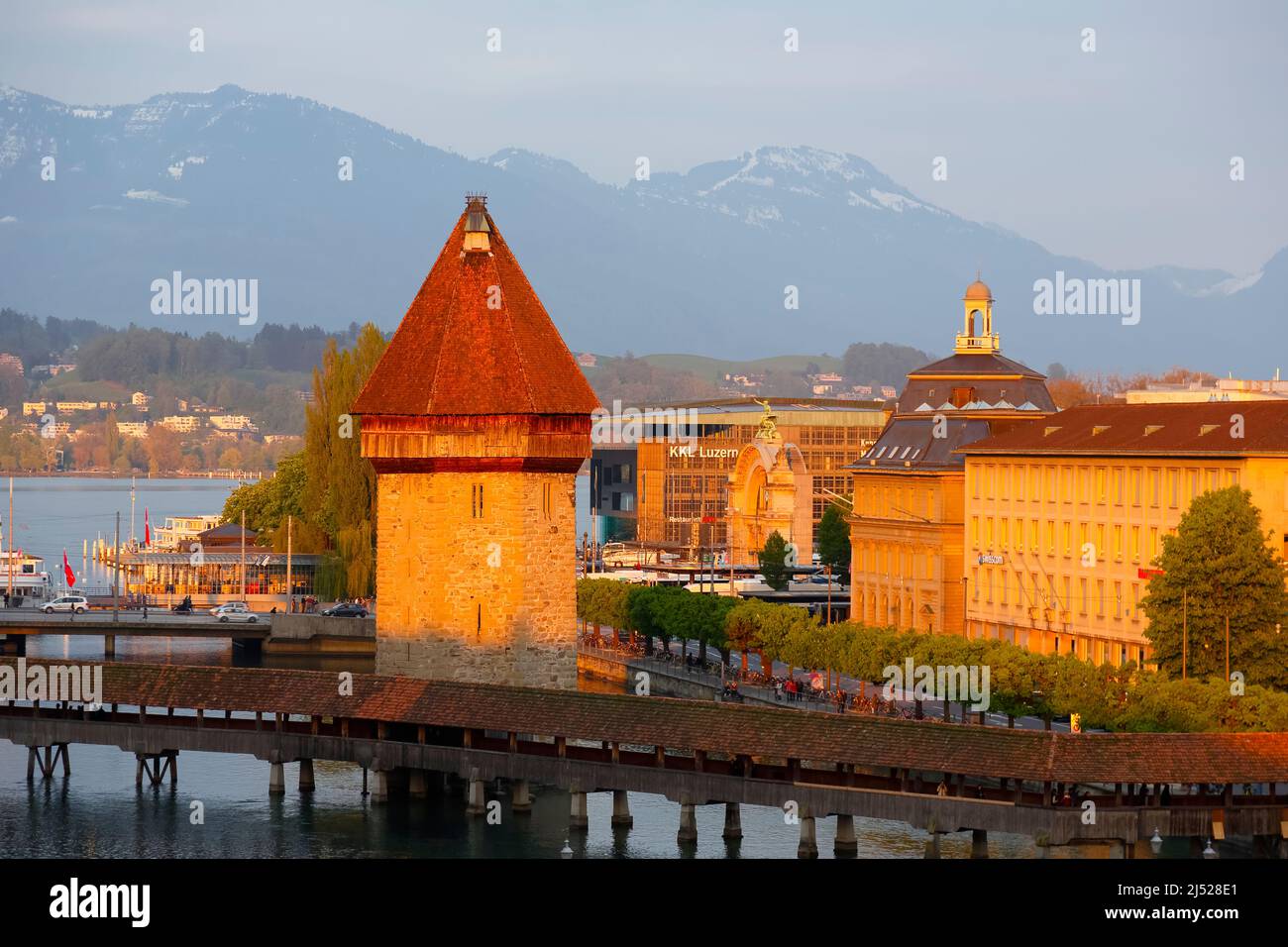 Lucerne, Switzerland - May 02, 2016: Evening view of the octagonal tower which was built in the Reuss River and is located next to the covered Chapel Stock Photo
