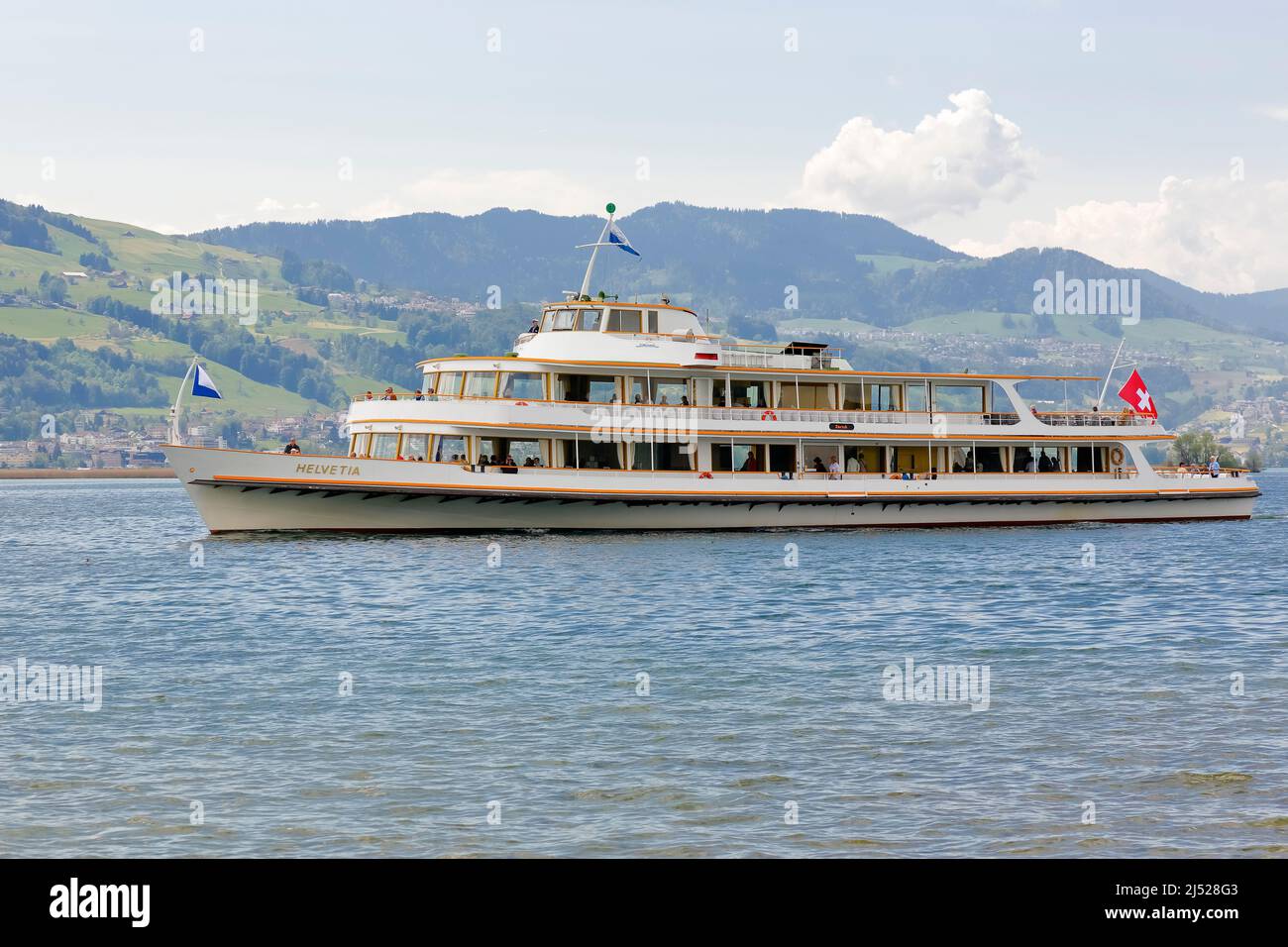 Rapperswil, Switzerland - May 10, 2016: MS Helvetia vessel arrives from Zurich to Rapperswill Ferry Terminal. The name Helvetia expresses the female n Stock Photo