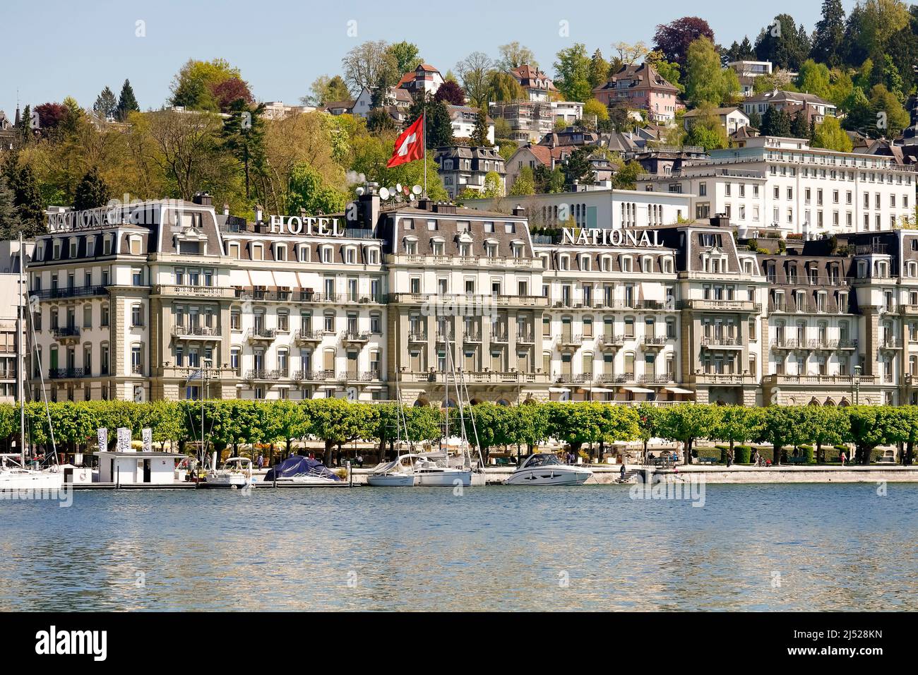 Lucerne, Switzerland - May 05, 2016: The Grand Hotel National front facade overlooks the lakeside promenade along Nationalquai, the hotel was opened i Stock Photo