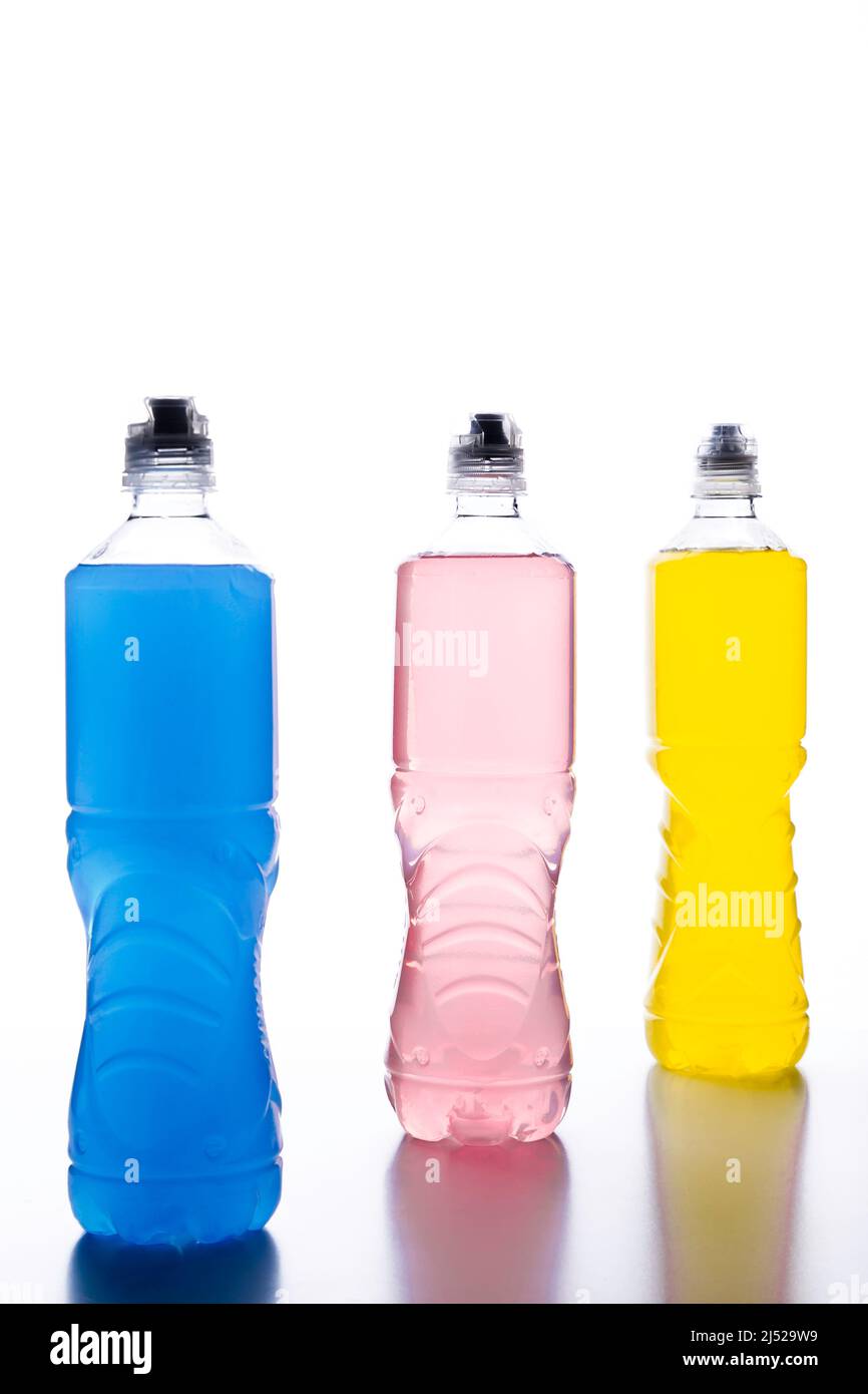 Plastic bottles with colored liquid. Colored bottles of sports