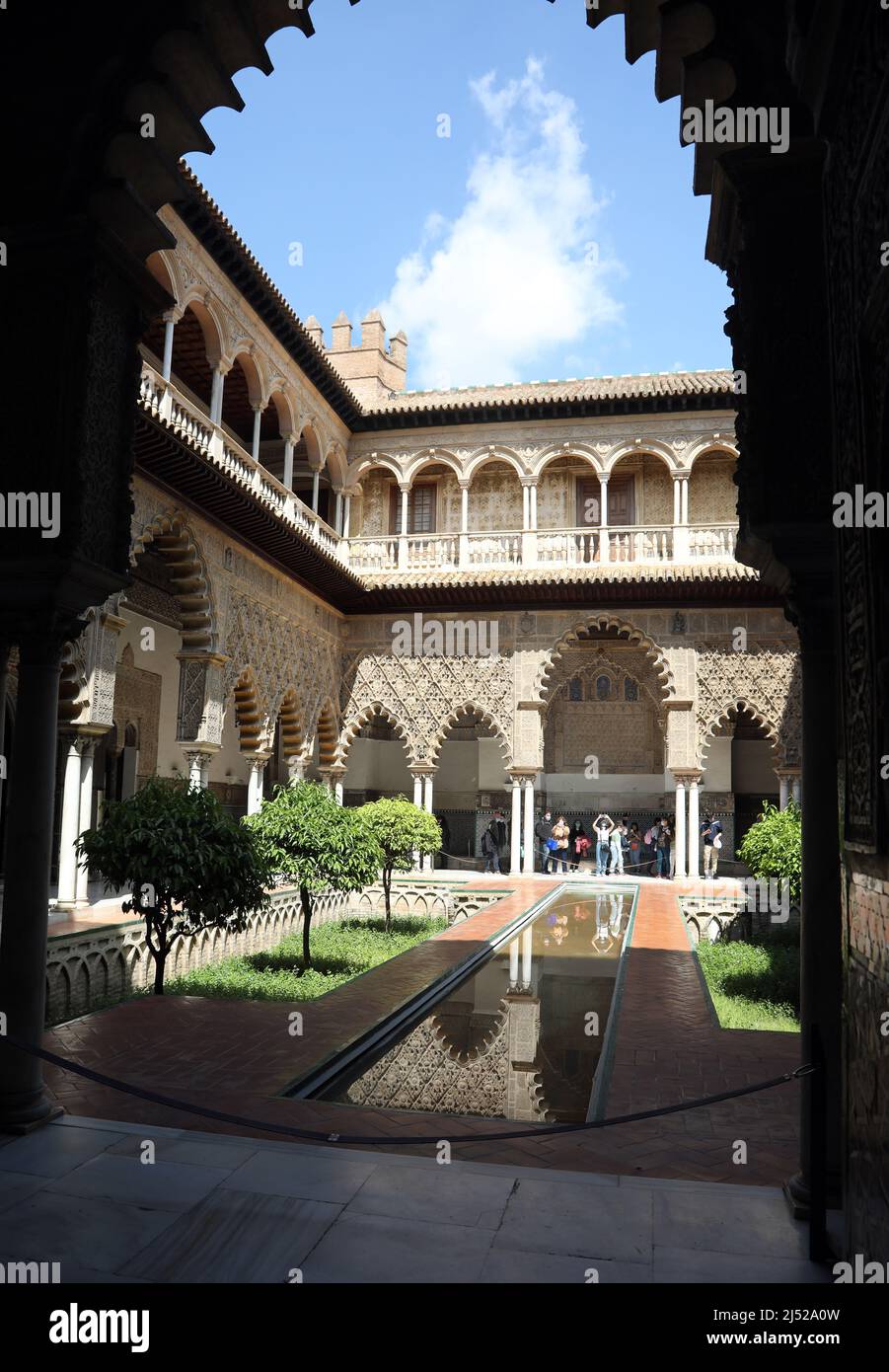 Pictured is the Patio de las Doncellas at the  Royal Alcázars of Seville,  a royal palace in Seville, Spain Stock Photo