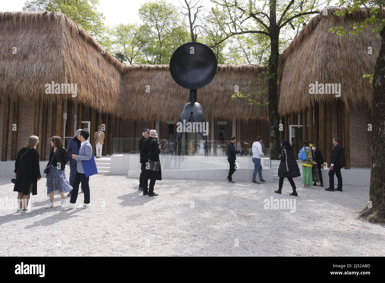Tourists and locals visit the Venice Biennale during the 59th International Art Exhibition (Biennale Arte) on April 20, 2022 in Venice, Italy. Stock Photo