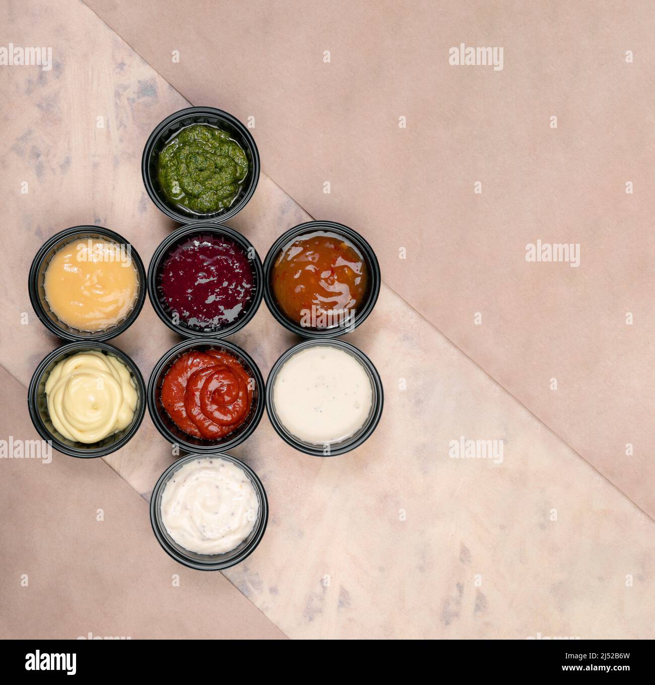 a group of sauces on a paper background with texture Stock Photo - Alamy