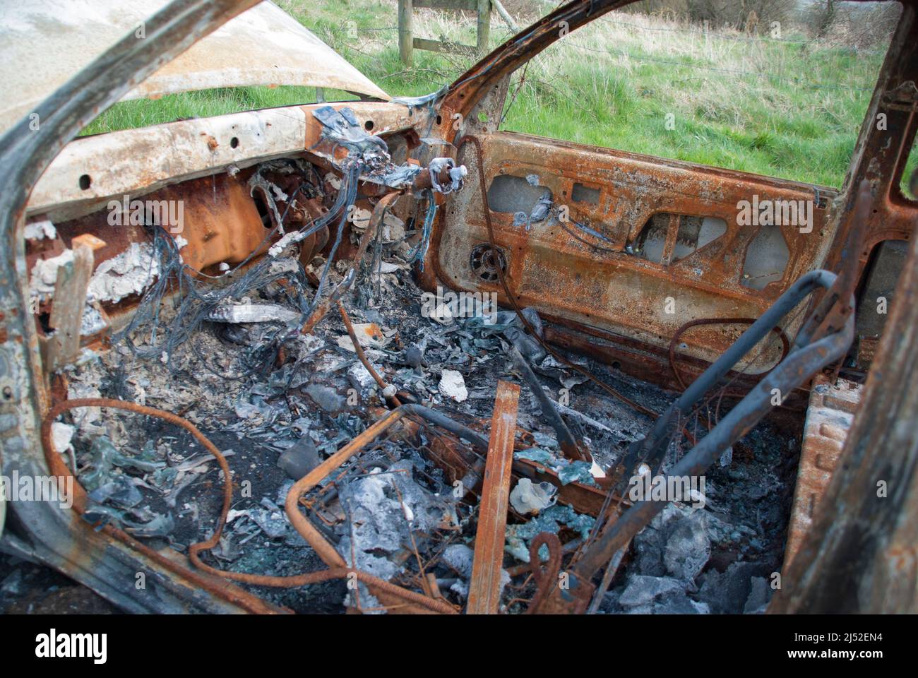 Inside a burned out, rusty, car Stock Photo