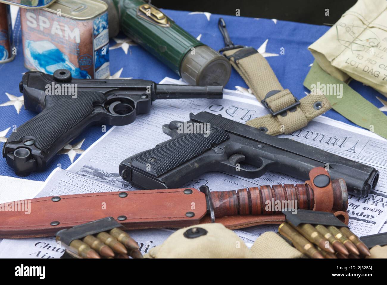 Hand Gun and knife on a newspaper with the headlines operation Tonga Stock Photo