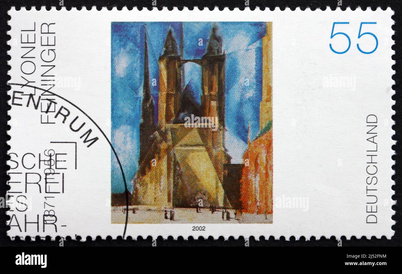 GERMANY - CIRCA 2002: a stamp printed in the Germany shows Halle Market Church, Painting by Lyonel Feininger, circa 2002 Stock Photo
